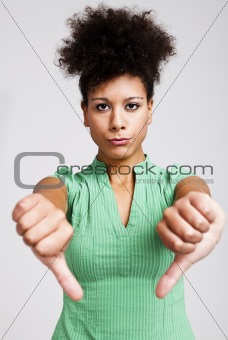 Beautiful woman with thumbs down