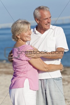 Happy Senior Couple Embracing on Beach