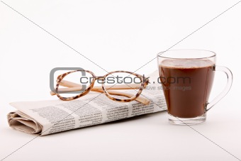 Reading the newspaper with coffee