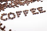 Coffee written with coffee beans on a white background
