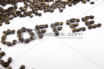 Coffee written with coffee beans on a white background