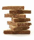 Stack of chocolate filled wafers on white background