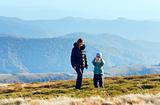 Family make photo on autumn  mountain plateau 