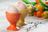 Eggs in orange and yellow eggcups