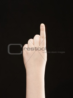 Childs hand with index finger pointing the way