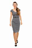 Full length portrait of business woman making first step