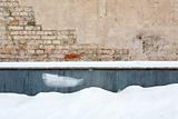 Brick wall and snow