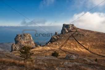 Rocks in mountains among clouds