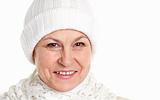 Smiling mature woman in winter cap