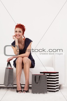 Beautiful redhead with shopping bags
