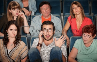 Man On Phone In Theater