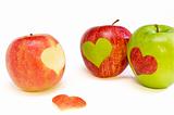 three apples with hearts