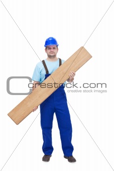 Worker carrying laminate flooring