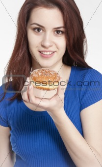 Young woman holding a donut