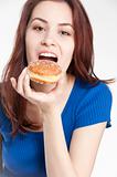 Young woman eating a donut