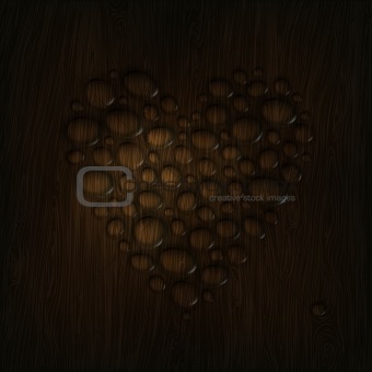 Heart shaped water drops on a wooden texture. 