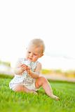 Baby playing on grass