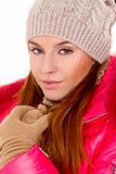 Young woman wearing winter jacket scarf and cap