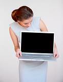 Young attractive business woman with laptop computer