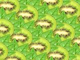 Background of fresh kiwi slices and green leaf