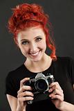 Redhead holding a camera