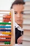 African American School Girl In Class Using Abacus