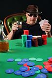 Serious poker player wearing sunglasses