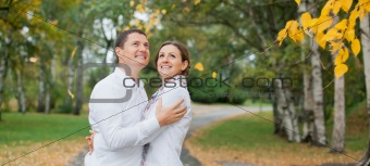 Romantic young beautiful couple on autumn walk