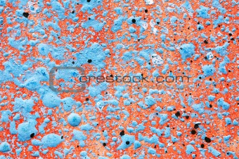 Blue paint splatter on red background