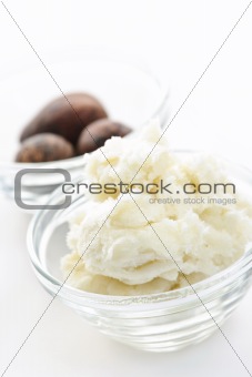 Shea butter and nuts in bowls
