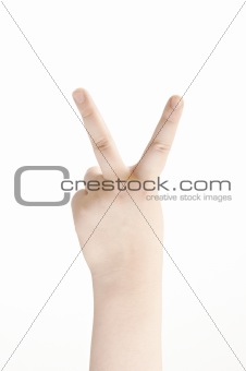 Victory sign shown by childs hand