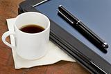 tablet computer, stylus and coffee