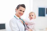 Portrait of pediatric doctor with baby