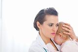 Pediatric doctor calming baby
