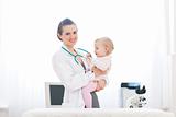 Pediatric doctor and baby on survey