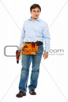 Full length portrait of construction worker looking on side