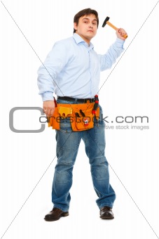 Construction worker brandishing hammer