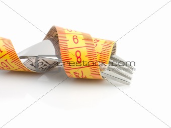 Dieting concept with metallic fork with meter