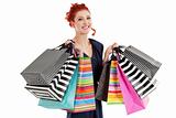 Beautiful woman holding colorful bags