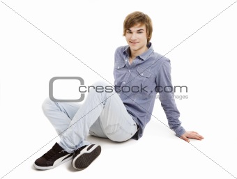 Young man sitting on the floor