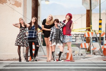 A group of attractive teen punk girls pose for the camera