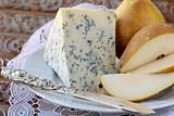 Blue cheese and pears on a vintage background