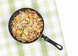 Rice with mix vegetables in a pan