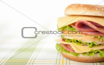 sandwich with ham, cheese, tomatoes and lettuce