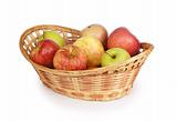 apples in a basket isolated on white