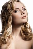 blond young girl with stylish curled hair