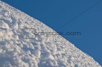 Untouched snow and clear blue skies