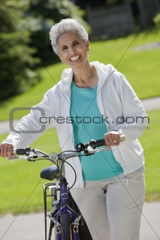 Senior woman with her bicycle