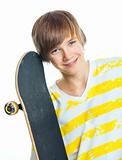 Portrait blond boy with skateboard