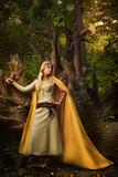Blond girl in a magic forest